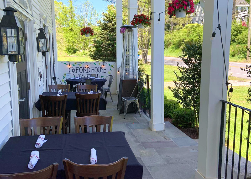 Dining area on the front porch of the Oxford House Tavern in Oxford, CT