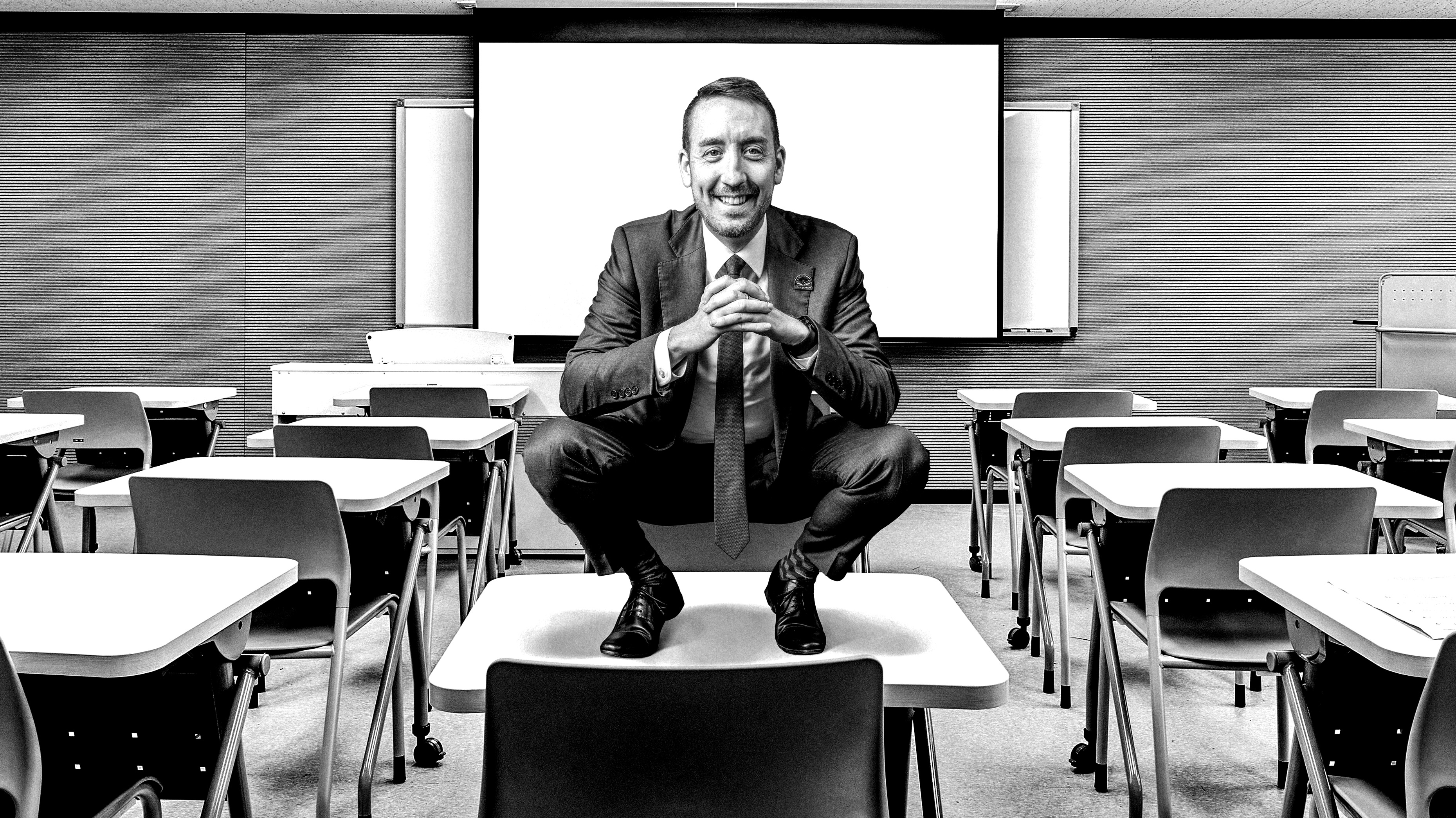 Waterbury, CT Superintendent Darren Schwartz standing on classroom desk