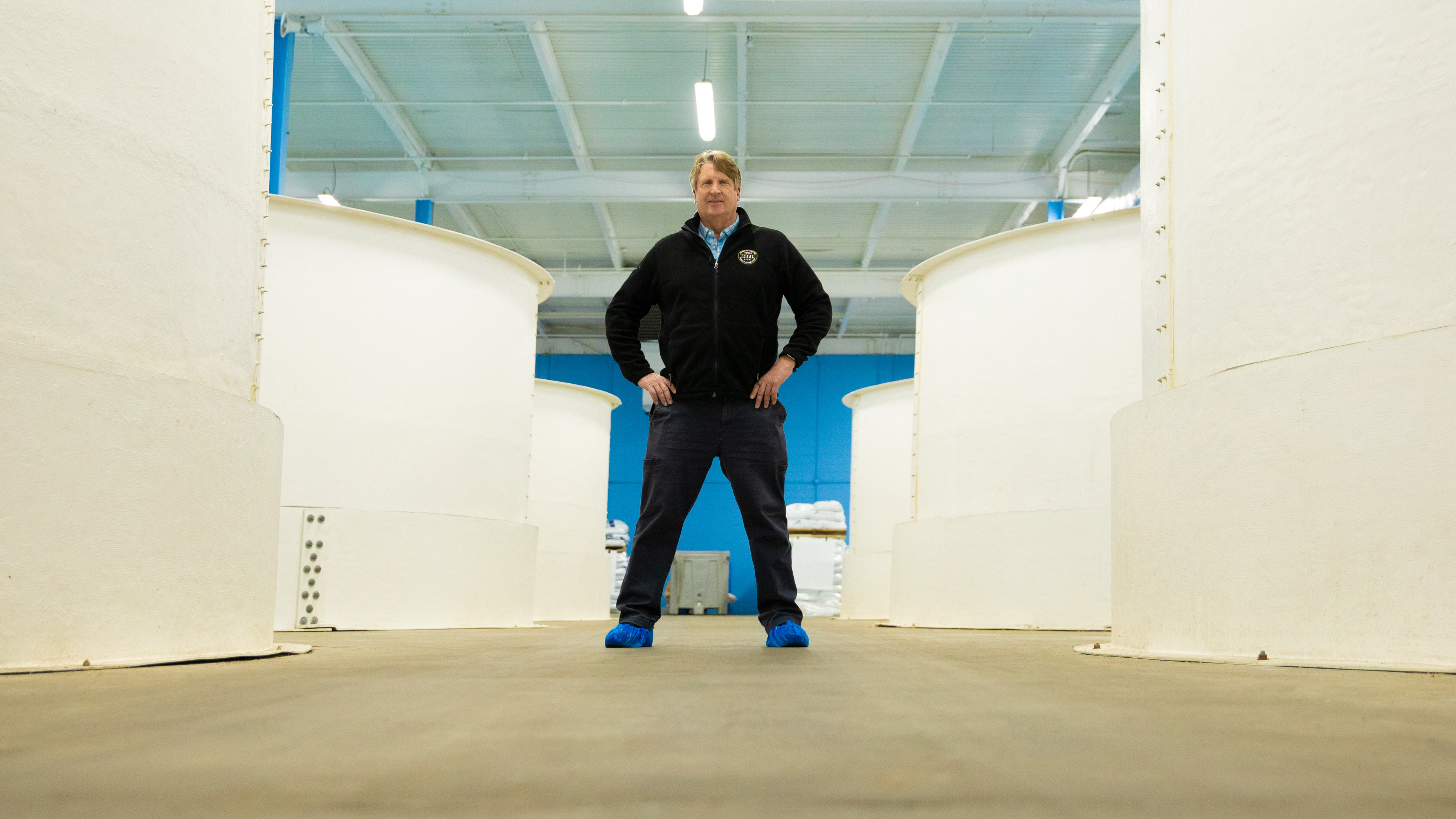 Ideal Fish CEO Eric Pedersen on ground floor of branzino facility