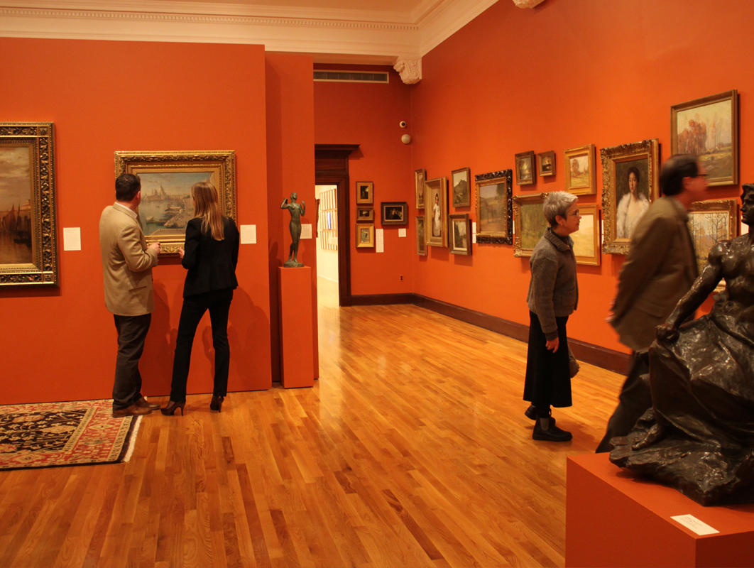 Patrons looking at the art hung on the walls of the Mattatuck Museum in Waterbury CT