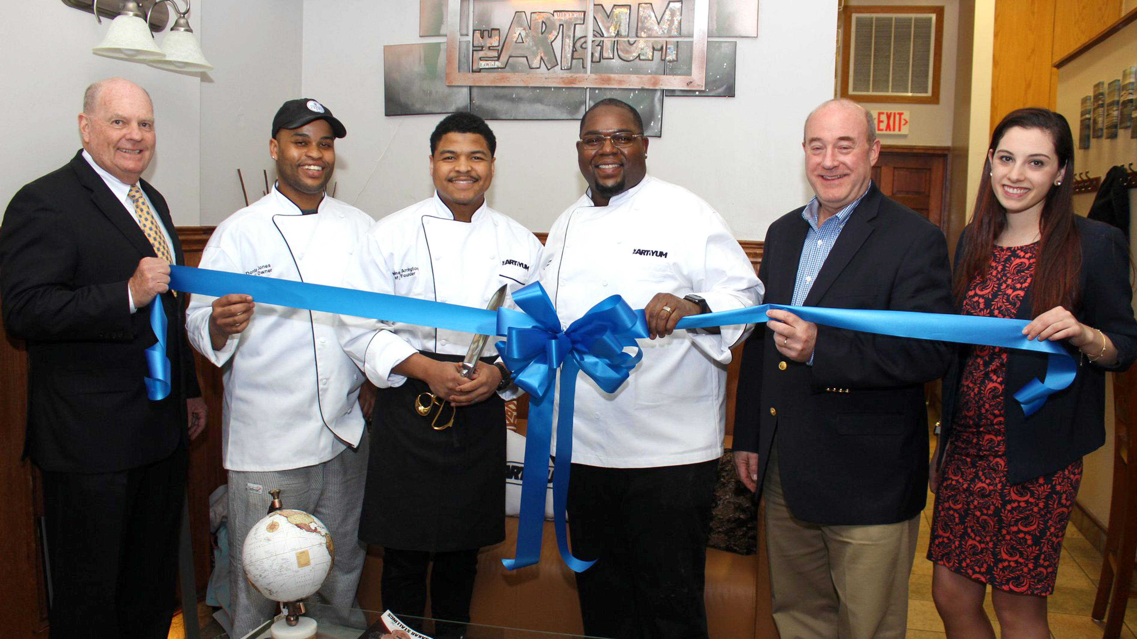 Ribbon cutting ceremony for the opening of The Art Of Yum in 2019