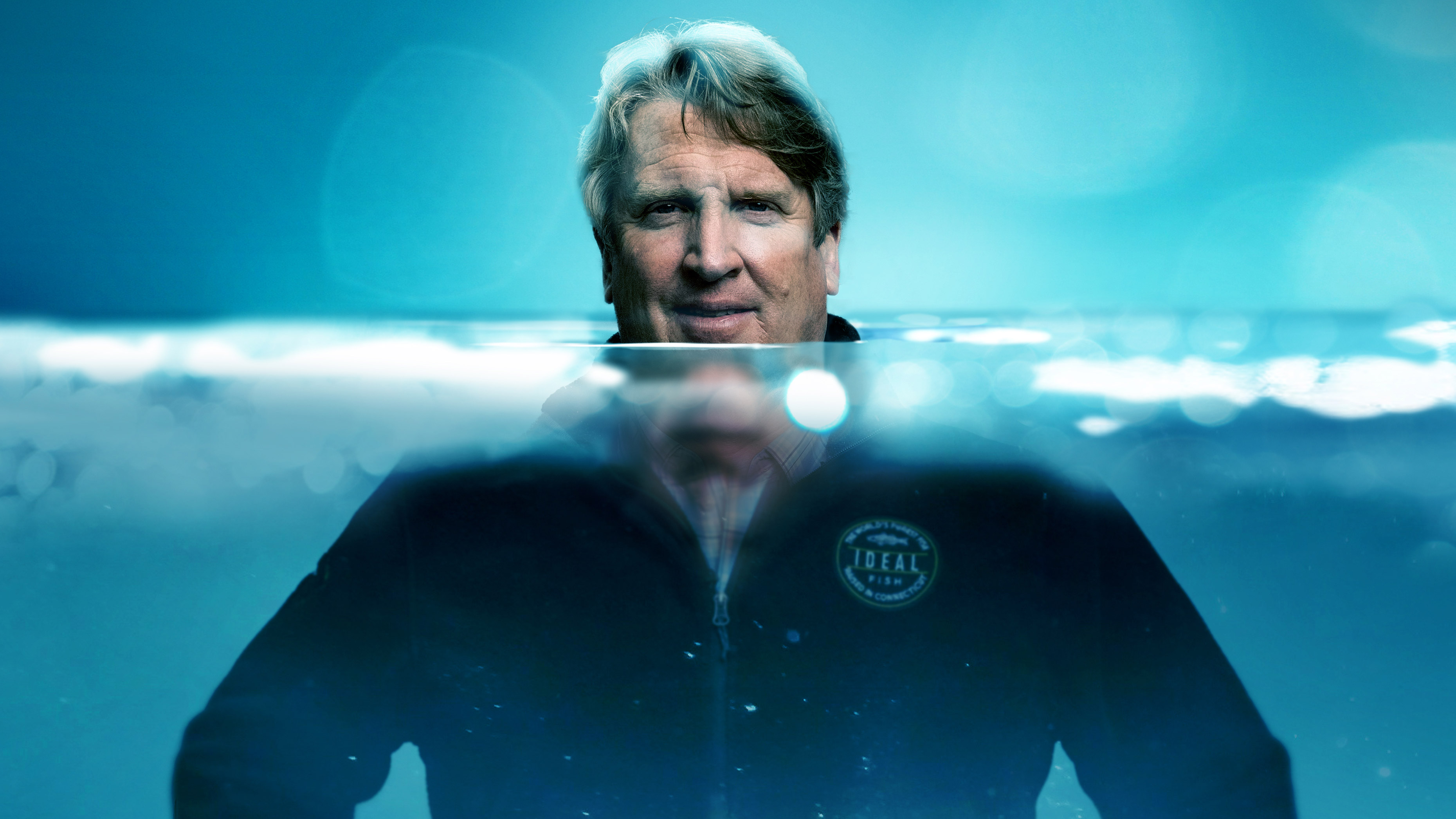 Ideal Fish CEO Eric Pedersen standing inside saltwater tank