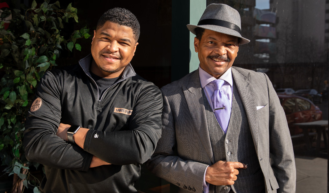 Michone Arrington and his father in front of The Art Of Yum