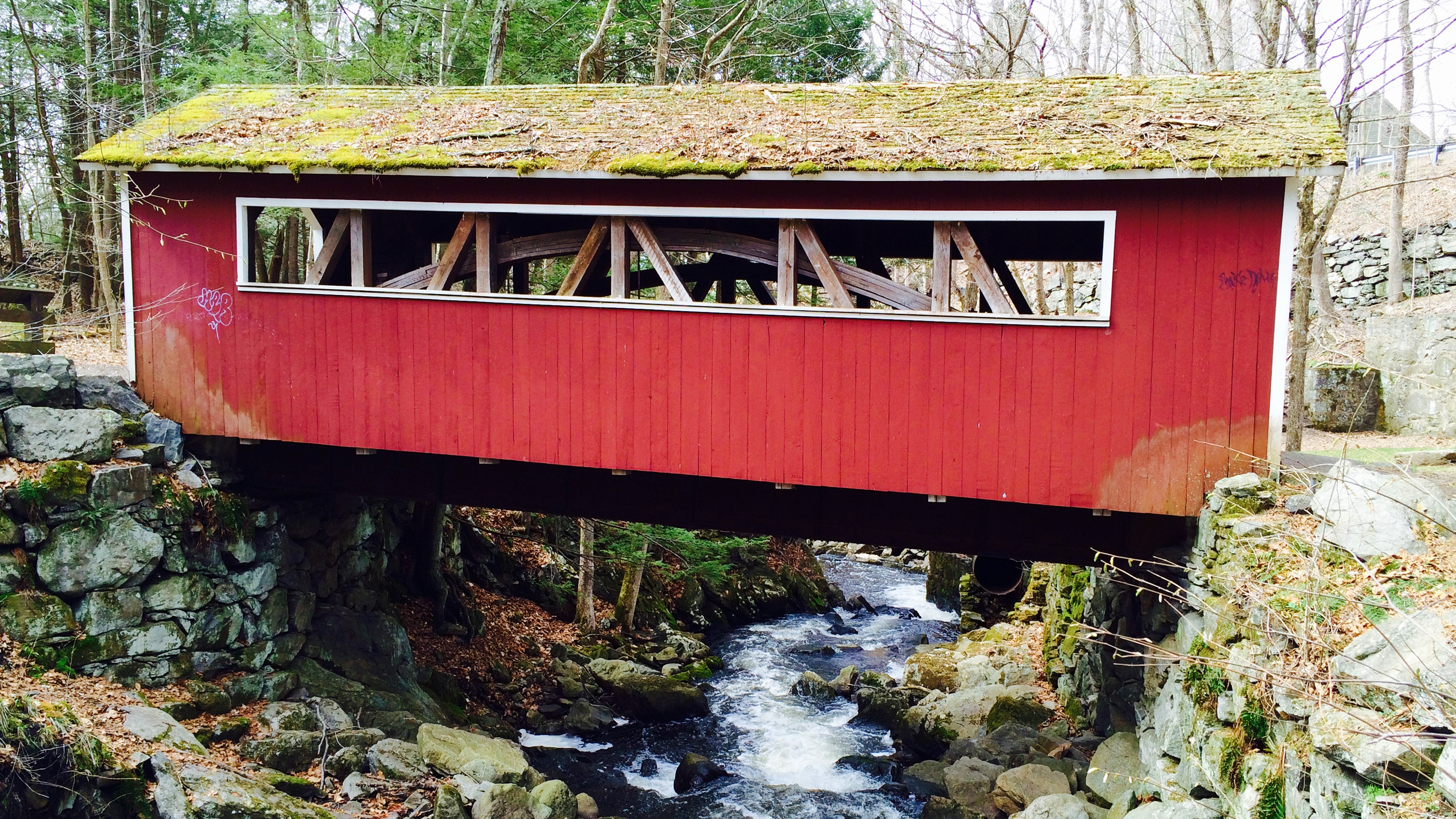 Red covered bridge over Eight Mile Brook in Southbury, CT