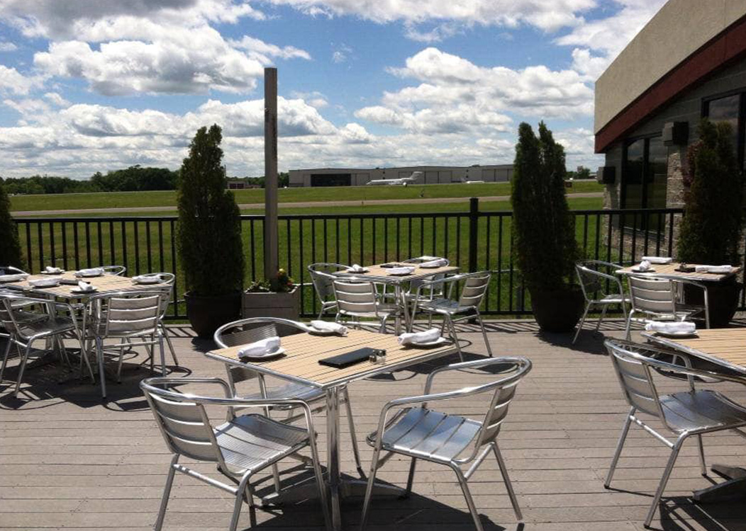 Outdoor patio dining area at 121 Restaurant overlooking the Waterbury-Oxford Airport in Oxford, CT