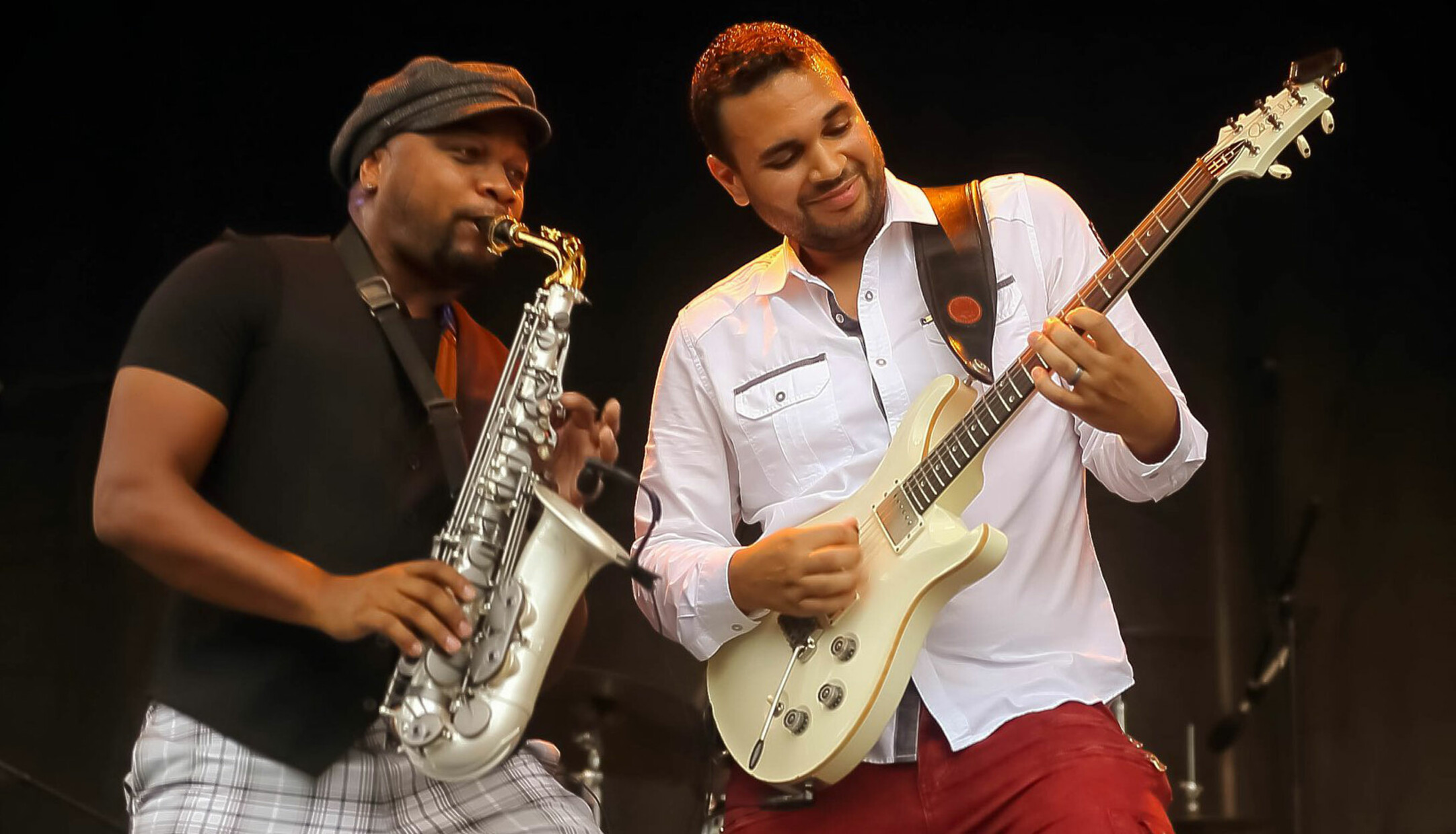 A saxophone player and guitar player featured at the Brass City Jazz Fest in Waterbury CT