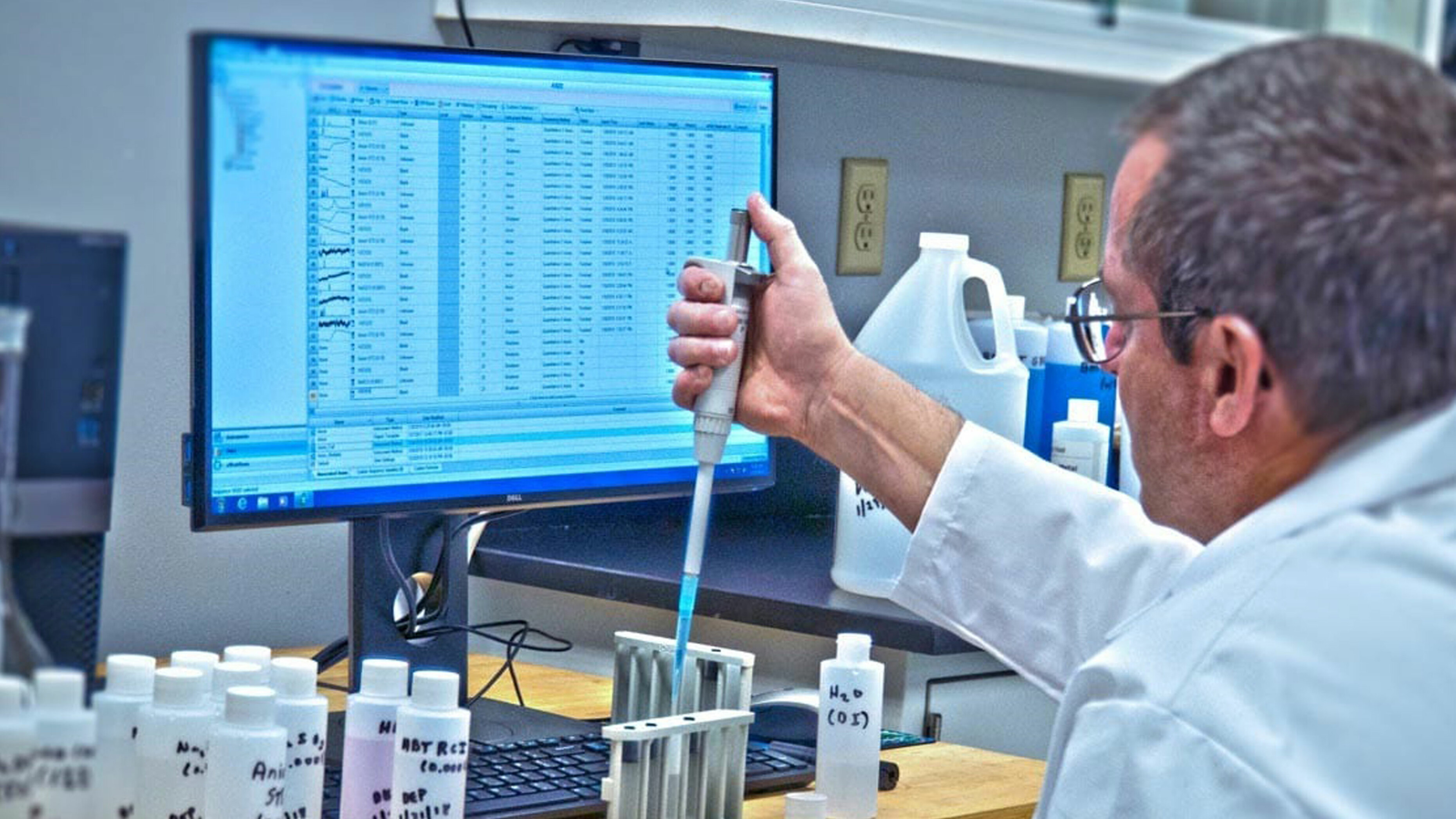 Scientist at work with chemicals at Hubbard Hall in Waterbury CT