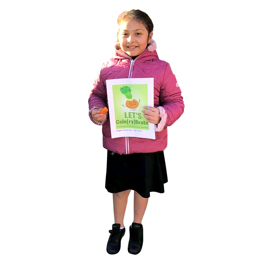 A Waterbury student smiling and holding a healthy eating flyer
