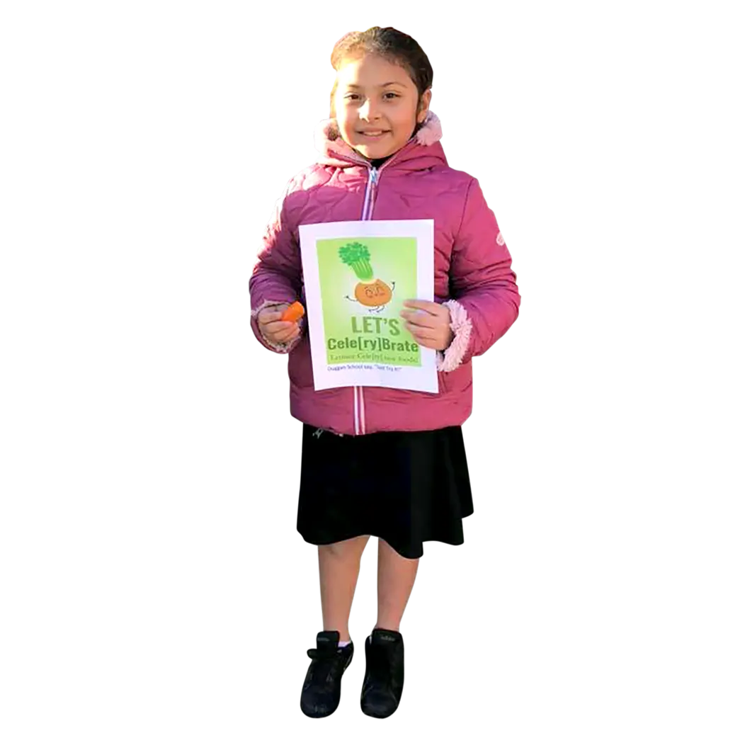A Waterbury student smiling and holding a healthy eating flyer
