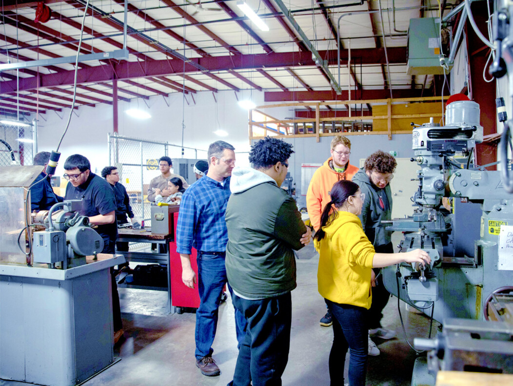 A group of people learning how to use equipment and studying trades as MASC in Waterbury CT