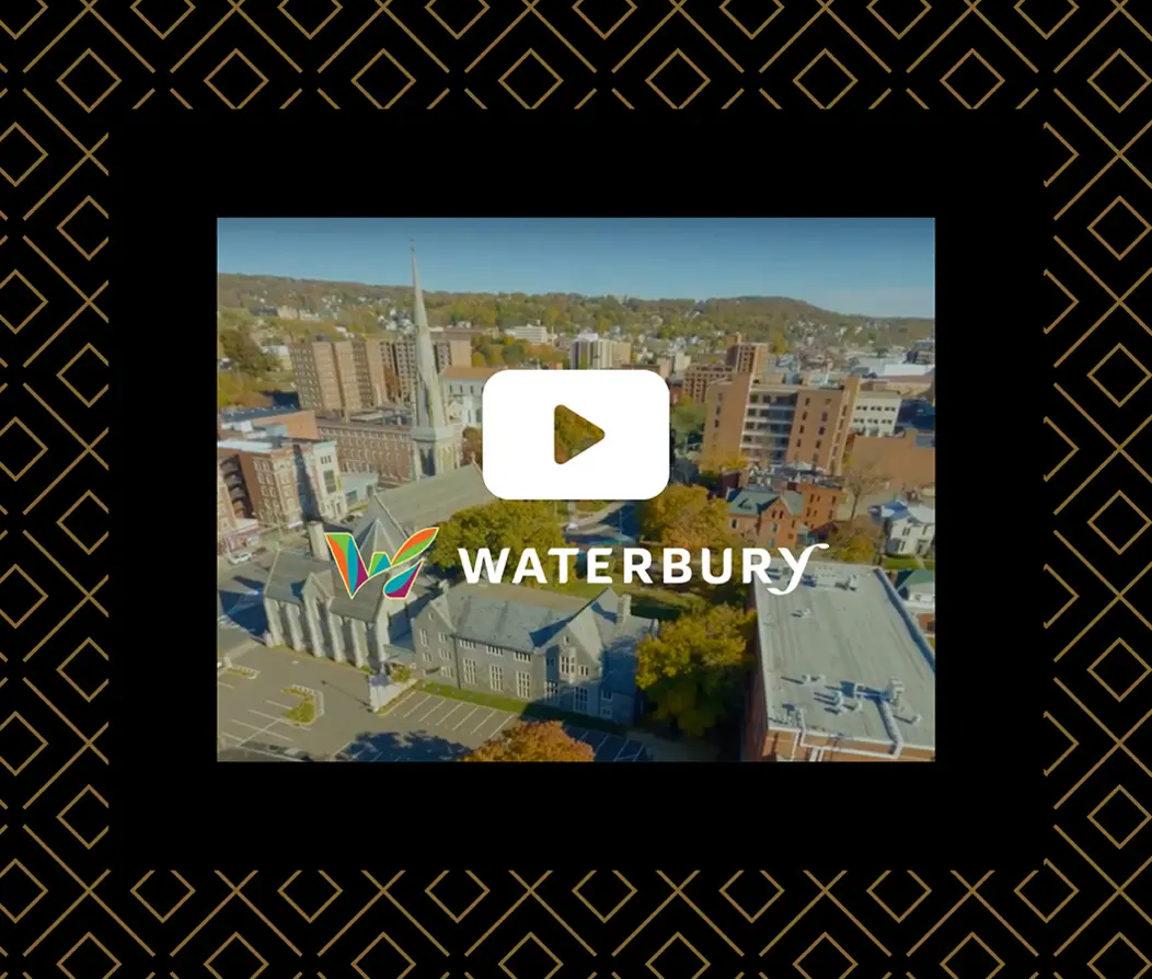 Waterbury city skyline with The Waterbury logo and video play button
