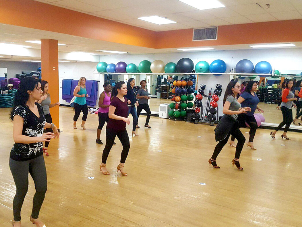 Women participating in a health and fitness dancing class at the Waterbury YMCA