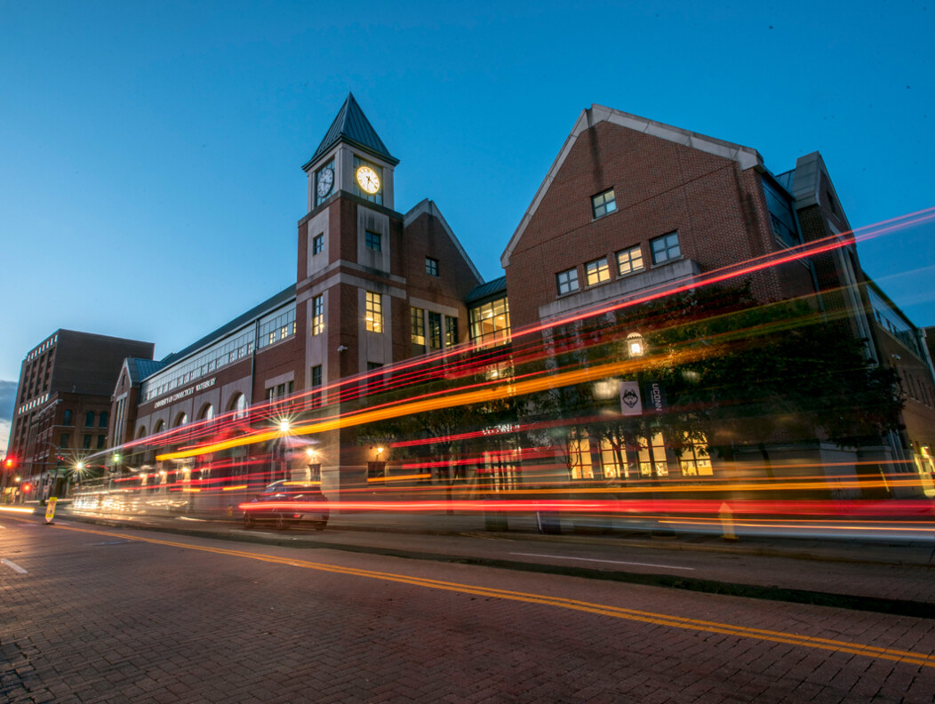 Exterior of UConn Waterbury building in downtown Waterbury CT with car driving by