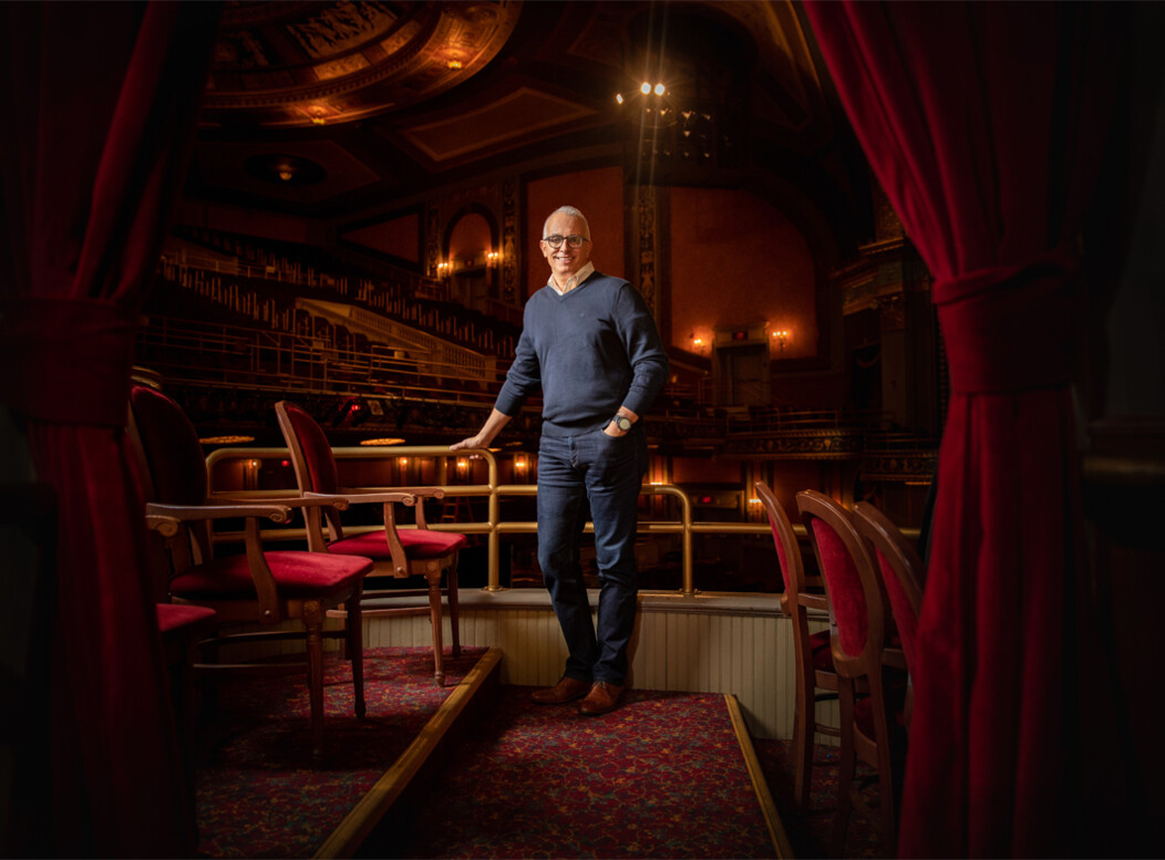 Frank Tavera, the CEO of The Palace Theater in Waterbury CT, standing in the audience seats